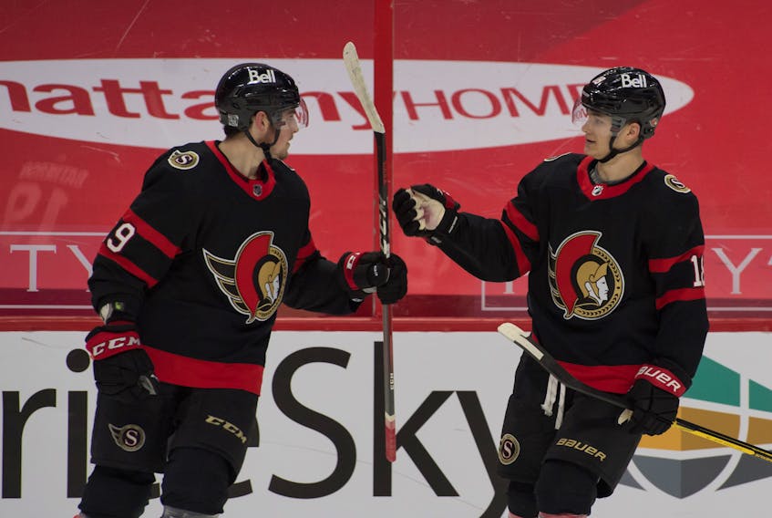 Ottawa Senators winger Drake Batherson (19) of New Minas celebrates with linemate Tim Stutzle (18) after scoring against the Calgary Flames in Ottawa. Batherson is one short of tying franchise record of goals in six straight games. - Marc DesRosiers / USA Today Sports