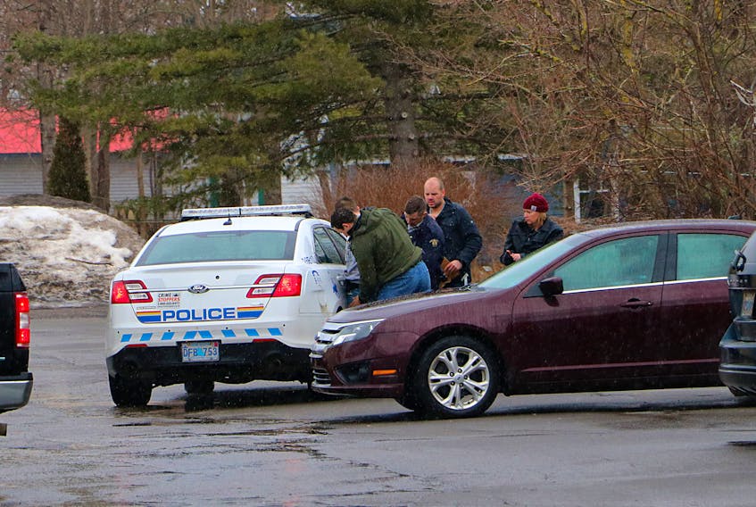 RCMP frisk a suspect after an incident at the Irving gas station in Berwick Thursday Feb. 27, 2020. Photo credit Adrian Johnstone