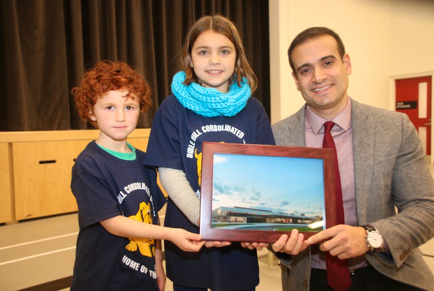 Bible Hill Consolidated students Hudson Dill and Kate Wyllie presented Minister of Education and Early Childhood Development Zach Churchill with a photo of the school when he visited for the official opening ceremony.
LYNN CURWIN/TRURO DAILY NEWS