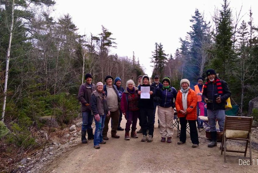 Members of the group Extension Rebellion, who have been blocking access roads to WestFor forestry operations for nearly two months, were served an interim injunction Friday to remove the blockades.