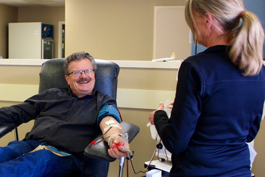 Nurse Sheila McKillop shares a laugh with Larry Sider as he donates plasma at the Charlottetown clinic for Canadian Blood Services, located at 85 Fitzroy St.