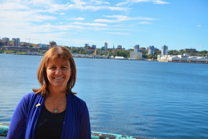 Bonnie Sutherland, executive director of the Nova Scotia Nature Trust, stands on the deck of a Dartmouth restaurant after an September 2020 announcement.