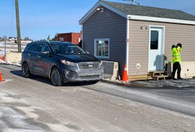 A vehicle is checked at the Nova Scotia border control point at Fort Lawrence early Saturday. While some speculated Nova Scotia’s decision to reopen the border a month ahead of the Atlantic bubble’s re-established would lead to heavy traffic, New Brunswick has maintained the status quo, requiring people entering that province from Nova Scotia to self-isolate for 14 days.