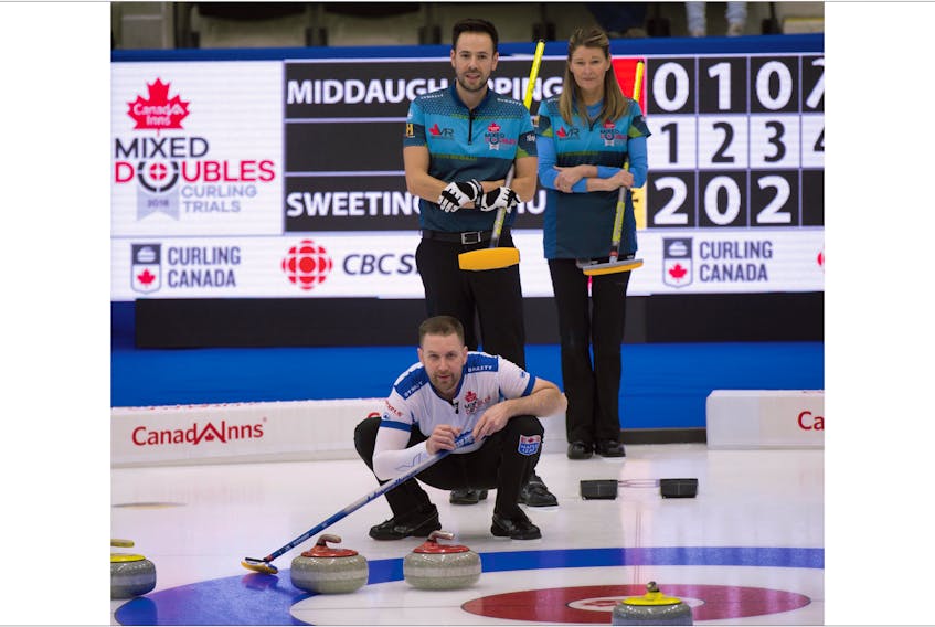 Michael Burns/Curling Canada — Brad Gushue checks the line on a shot by teammate Val Sweeting (not shown) as John Epping and Sherry Middaugh look on during a preliminary-round game at the Canadian mixed doubles Olympic trials in Portage la Prairie, Man., on Wednesday. Gushue and Sweeting won 10-8 for their first win at the event.