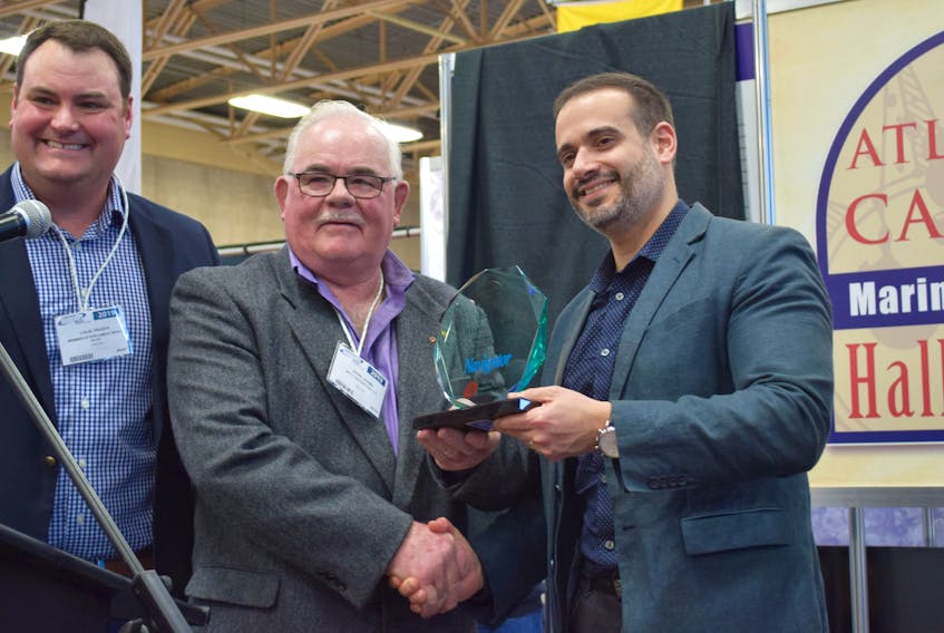 Brian Adams is presented with his Atlantic Canada Marine Industries Hall of Fame recognition by West Nova MP Colin Fraser (left) and Zach Churchill, Yarmouth County MLA and Minister of Education and Early Childhood Development, during the Jan. 25 ceremony in Yarmouth.