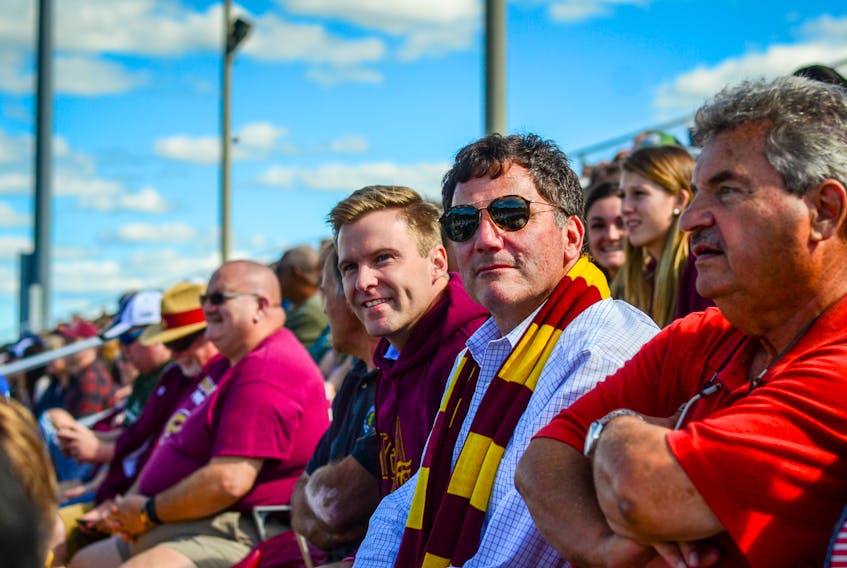 Brian Gallant, left, shown here at a Mount Allison football game with Liberal MP Dominic LeBlanc and recently-ousted MLA Bernard LeBlanc during the election campaign, will try to keep his Liberals in power as he heads back to the Legislature on Tuesday, despite only having 21 seats to the Progressive Conservatives’ 22.