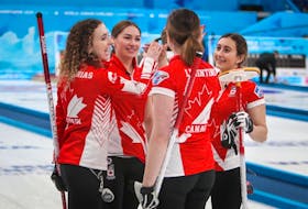 Karlee Burgess, second from left celebrates with teammates Mackenzie Zacharias, left, Lauren Lenentine and Emily Zacharias after winning the world junior curling championships in Krasnoyarsk, Russia, on Saturday. Contributed