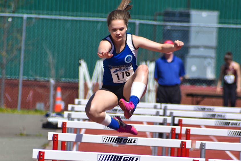 Cape Breton’s MacKenzie Roach clears a hurdle during the 2018 Nova Scotia Schools Athletic Federation Track and Field Championship at Cape Breton University on Friday. Roach was competing in the girls 80-metre hurdles 33” division.