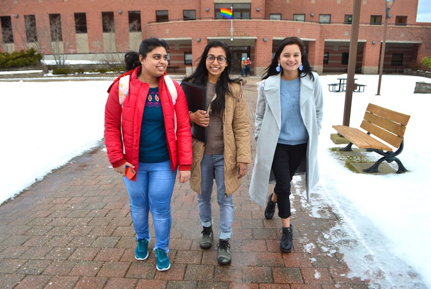 It's a new year and new students are arriving at Cape Breton University. Arshdeep Kaur, left, a third-year hospitality student, was showing new students Shubhpreet Kaur, centre, and Simran Kaur around the campus on Thursday. Shubhpreet Kaur arrived in Cape Breton Wednesday and is enrolled in the business analytics program while Simran Kaur arrived Tuesday to study in the business management program. The new students found Cape Breton cold but were excited to see and experience snow for the first time. CBU reopened Thursday following the Christmas holidays. University officials say a new group of about 500 international students has arrived for the second semester.