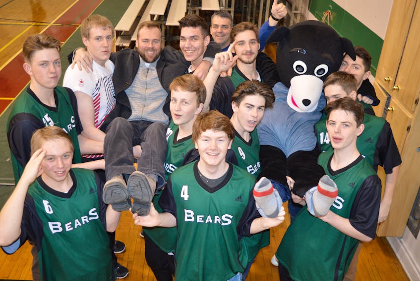 Members of the Breton Education Centre Bears Boy’s Basketball Team have a little fun with coach Greg Campbell and the bear’s mascot Breton Eddie, while in the gym preparing for the 36th annual Coal Bowl Classic. Shown above: In front, from left, Tony Tighe, Bobby Odo, Sam Stacy; second row, from left, Morgan MacIsaac, Dylan MacSween, Aaron MacLean, Jason Murphy; third row, the left, Robert Odo, coach Greg Campbell, Jordan Hennessy, Mitchell Rutledge, Dylan Messervey, and, in back, Sandy Kearney, assistant coach. Teams will begin arriving today and the tournament will kick off with games beginning at 2 p.m. The official opening ceremonies are set for 7 p.m. Monday.