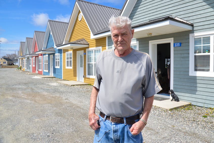 Angus MacDonald, a tenant of the New Aberdeen Garden Townhouses in Glace Bay, stands outside the complex where he has lived with his wife Hazel for three years now. MacDonald said although the owners have filed for bankruptcy the units are nice to live in and he is confident there will be a buyer.