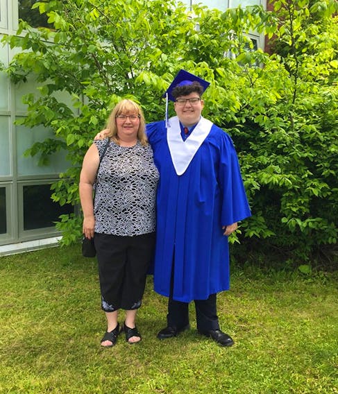 Sefin Stefura (right) stands with his mom, Cathy Stefura, outside Sydney Academy before his graduation on June 27. The transgender teen struggled with acceptance from his family when he came out in grade seven but said he now gets support from many of them, including his mom. “My mom and I are very close now,” he said. Stefura was named Sydney Academy’s 2019 valedictorian and it’s believed to be the first time a trans person in Cape Breton has achieved this.