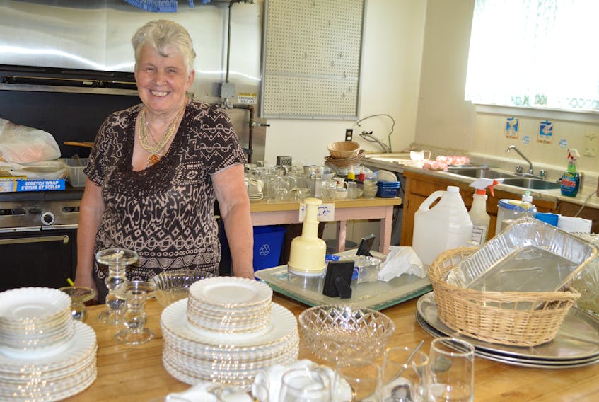 Viola Penny, a member of the Carmel Centre Society, stands in the kitchen full of items still for sale in the centre.