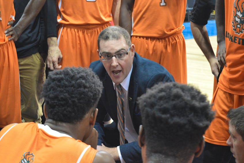 In this file photo from last season, Cape Breton University Capers men's basketball team head coach Dave Petroziello talks to his team on the sidelines during a regular season game at CBU. CAPE BRETON POST PHOTO