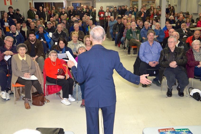 Fr. Albert Maroun, a co-founder of Nova Scotians for Equalization Fairness, addresses a crowd at the government watchdog’s public meeting at the Cedars Club in Sydney on Tuesday. The group plans to protest in front of the Provincial Building on Prince Street in Sydney early next month.