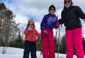 From left, Lucy Graves, her sister Lydia and her mother Marjorie enjoyed snowshoeing in the backyard of their Marion Bridge home last week, as part of their self-isolating activities while following COVID-19 precautions.