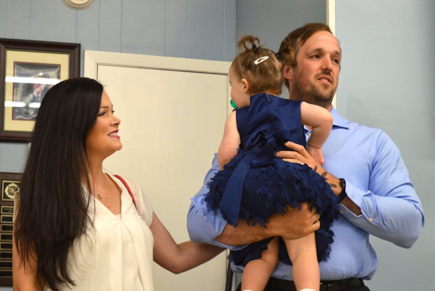 MLA-elect Brian Comer is shown with his wife Jennifer and daughter Maria at the Sydney River Fire Hall following Comer’s byelection win for the Progressive Conservative party in the riding of Sydney River-Mira-Louisbourg on Tuesday.
