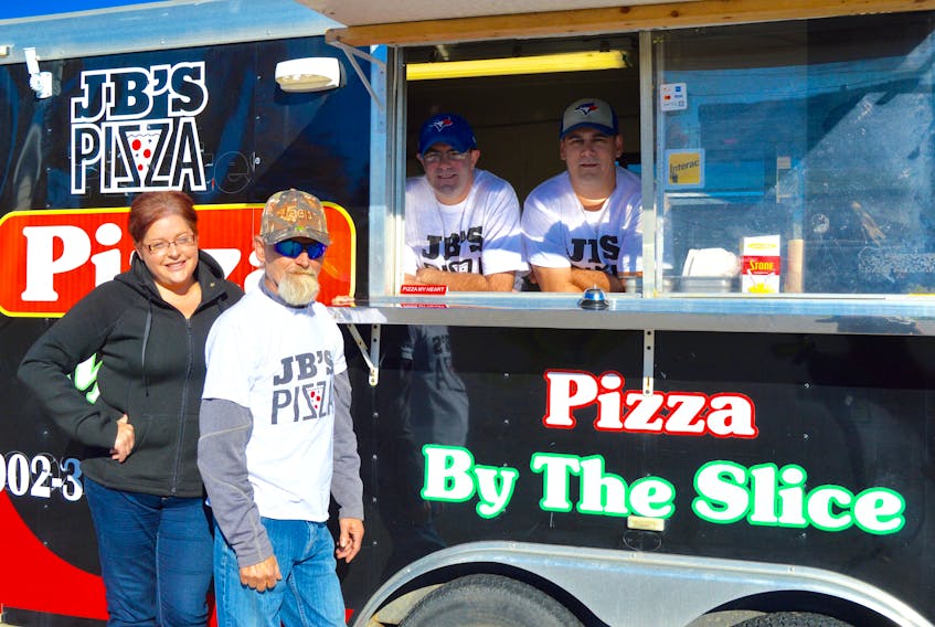 Amy Griffiths, from left, Jimmy Griffiths, Ryan Rudderham and Archie Williams are serving up hot pizzas and oven baked subs from their new pizza truck, Jim Bob’s Pizza, at the Sydport industrial park.