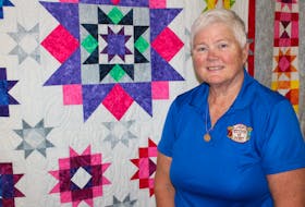 Jacquie Gillis, owner of the Mira Stitch ‘n Post in Marion Bridge, is shown in her shop with one of the colourful quilts on display. Gillis has been in business at the location for 12 years and was recently named one of the top sellers of sewing machines in North America for SVP Worldwide.