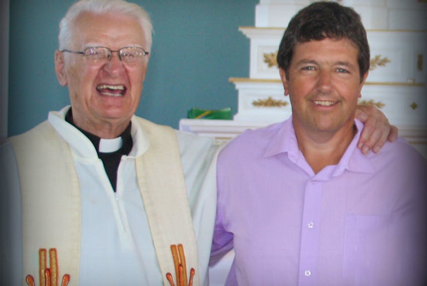 Rev. Hugh D. MacDonald is pictured alongside Bob Martin, who credits the long-serving Catholic priest with helping to get him into a foster home as a teen.