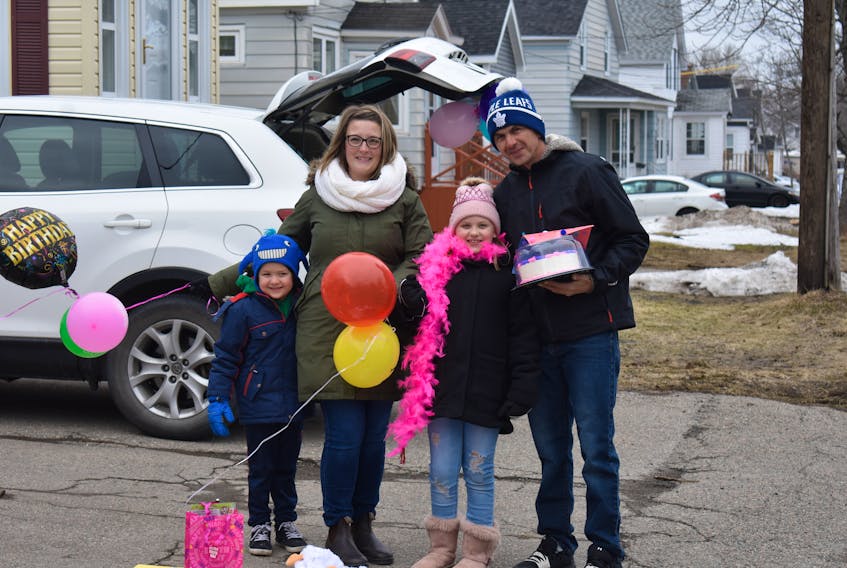 Nine-year-old Layla MacDougall, her mother Stephanie Pitchuck, her father Thomas MacDougall and her brother, Shamus MacDougall celebrated a surprise driveby birthday party for the Sydney girl Saturday afternoon. Social distancing prevented Layla from having a conventional party, so friends and family drove by their Royal Avenue home.