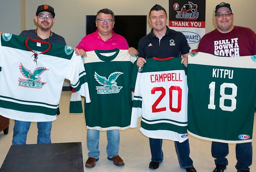 The jerseys for the Nova Scotia Junior Hockey League’s newest team, the Eskasoni Junior Eagles, were revealed on Friday. Shown from left to right are Pierre Gould, Eskasoni band councillor Dion Denny, Chief Leroy Denny and Charles Gould.