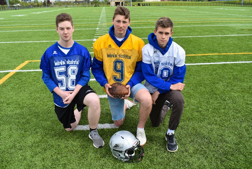 Three members of the Cape Breton Panthers bantam football team will represent the province at big tournaments this month. From left, 14-year-old Dawson MacNeil of Sydney and 15-year-old Mason Mills of Albert Bridge are members of the Nova Scotia U16 team, while 15-year-old Ethan Huntington of Marion Bridge is a member of the Nova Scotia U16 six aside team.