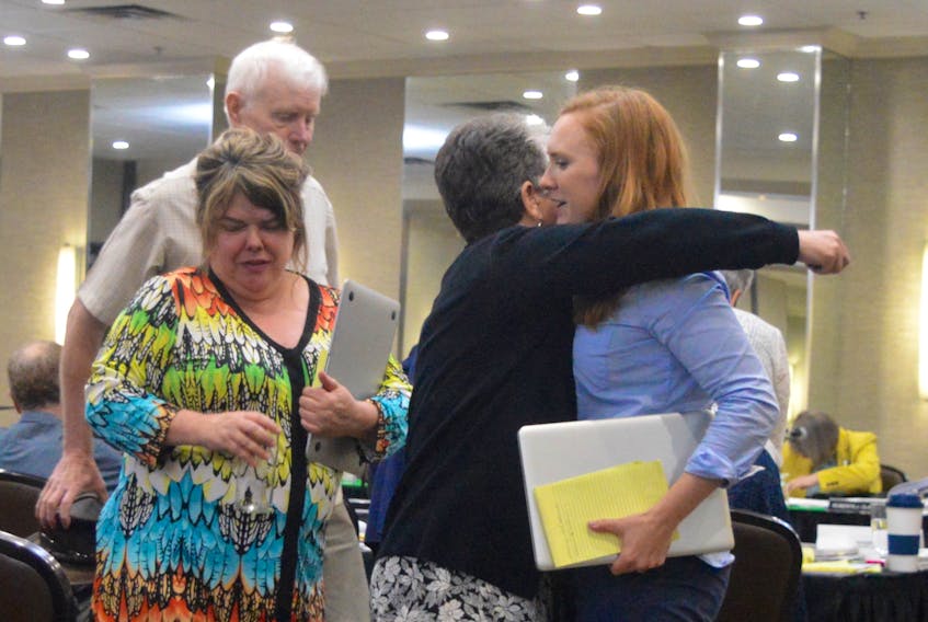 Big Pond Centre organic farmer Rita MacDonald gets a hug from aunt Paula MacInnis after testifying at a Nova Scotia Utilities and Review Board hearing into an appeal by a group of area residents who are challenging a CBRM council decision to amend its land-use bylaw to allow for the development of an RV park and campground in the central Cape Breton community.