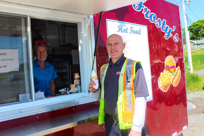With the sun shining, Noel Seymour of Glace Bay picked up a cool treat from Liz Vincent, supervisor of Frosty’s situated at the former Rollie’s Wharf location. The food and ice cream truck opened in North Sydney, near Indian beach, back in April. It features the same menu as its sister store on Keltic Drive. Summer hours for Frosty’s North Sydney are 11 a.m. to 10 p.m.
