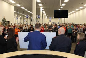Employees of the Sydney Call Centre watch as their $25,000 donation to the Salvation Army is unveiled. The donation comes almost one year after the call centre closed and its employees received assistance from the Salvation Army.