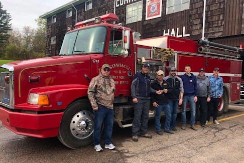 The Stewiacke and District Fire Department recently donated a used fire truck to the Ingonish Beach Volunteer Fire Department that needed another vehicle. From left are former Stewiacke Chief Brent Murdock, former truck committee chair Andrew Ashford, shown here handing the keys over to Ingonish Chief Ervin Barron, truck committee member Ben Sheehy, Stewiacke Deputy Chief Brandon Verboom, Scott Fisher and truck committee member Andy Lewis. Missing from the photo is current Stewiacke Chief Mark Crozier.