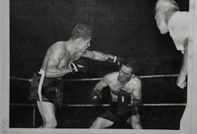 Tyrone Gardner (right) is shown versus Fernand “The Bull” Chretien with Bob Beaton referee.