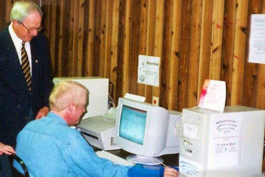 LeRoy Peach, left, and Jason Metcalfe at the opening of the computer lab in 1999.