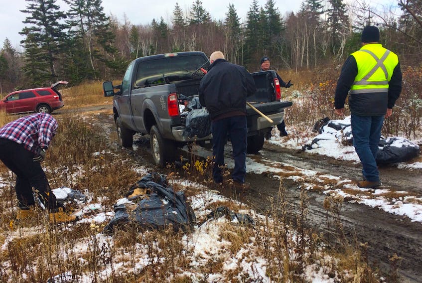 A work crew, including one inmate of the Cape Breton Correctional Facility, cleans up an illegal dumpsite with Cape Breton Regional Municipality solid waste staff and the police officer in charge of investigating these sites, Arnold McKinnon, in a wooded area close to Florence. Since June 2019, some inmates have been able to take part in a community outreach program which involves them working on teams with staff from corrections to help non-profit organizations and with community cleanups. Inmates have to apply to be a part of the program, which helps them develop skills and confidence, leading to greater success after release. The Cape Breton Correctional Facility is currently the only place offering this program in Nova Scotia.