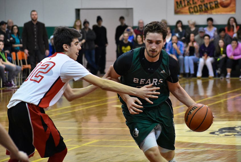 Mitchell Rutledge of the Breton Education Centre Bears, right, drives the lane while being guarded by Philippe Santerre of the Polyvalente de L'Ancienne-Lorette Athletiques of L'Ancienne-Lorette, Que., Tuesday at BEC gym. The Bears improved to 2-0 with a 59-50 win.