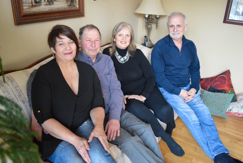 Carol Langille, Gerry Langille, Gina Wells and Bobby Gillis sit in a living room in the Langille’s Sydney River home. Carol Langille had to have her right leg amputated above the knee after a motorcycle accident in 2014. Complications with her limb causes her intense pain and doctors have referred her to a specialist in Australia who is world-renowned for his work in the field.