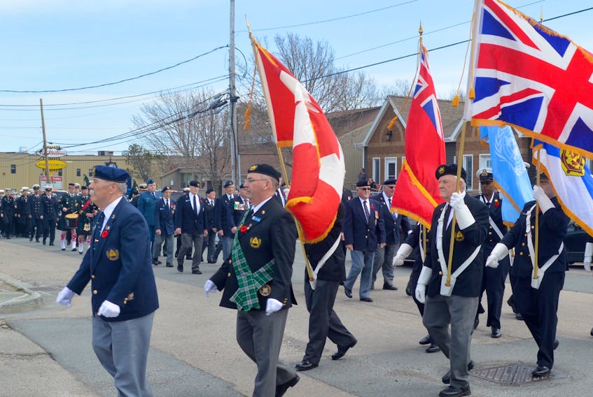 Shipmate Walter Stewart leads a parade of Canadian veterans and cadets as they marched to form the Army Navy Air Force Unit 217 club to Calvin United Church in New Waterford, where a commemorative service was held to acknowledge the anniversary of the ending of the Battle of the Atlantic.