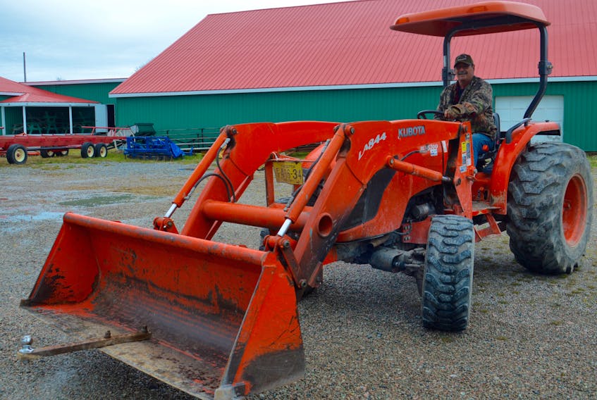 Gerry Apesteguy drives a tractor at the Cape Breton County Exhibition Grounds on Regent Street in North Sydney on Thursday. Plans are well underway for this year’s Cape Breton County Farmers Exhibition, which will take place Aug. 13-18.