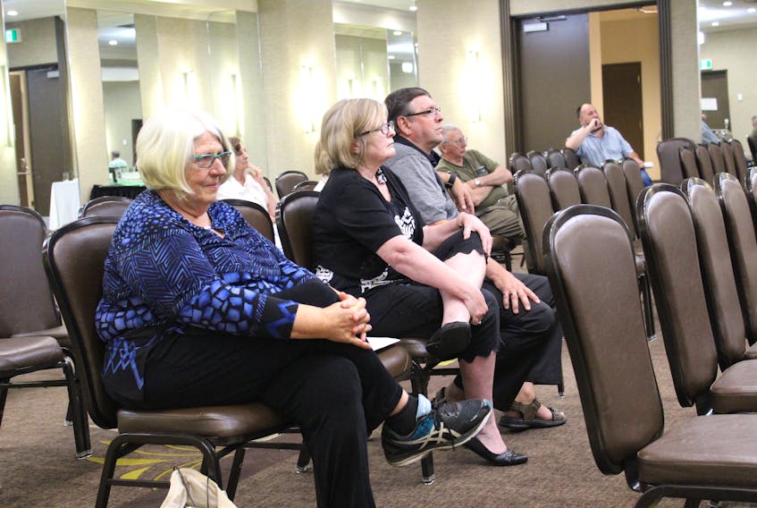 Helen Doherty, left, listens to the proceedings at a Utility and Review Board hearing Friday in relation to the development of a RV park and campground in her home community of Big Pond. Doherty testified Friday that the development will interrupt the serenity of her rural neighbourhood.