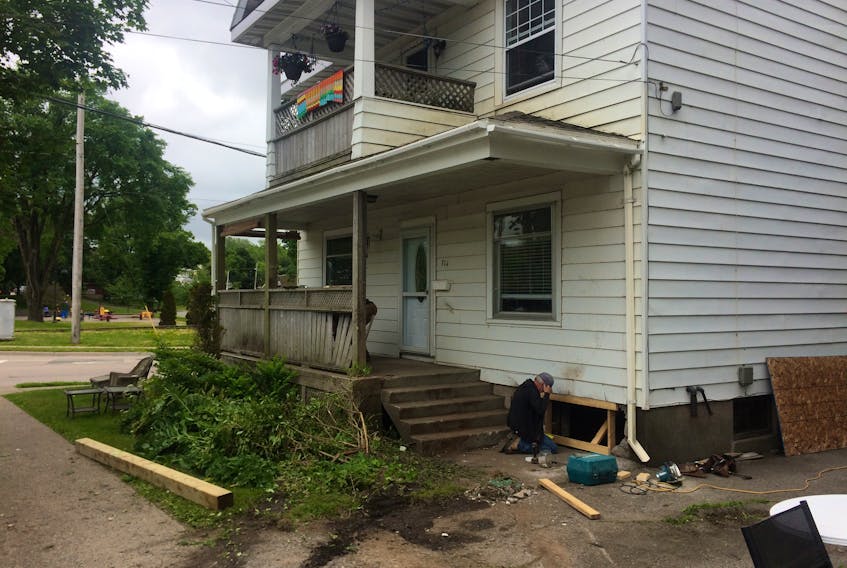Damages were being repaired Monday at a Sydney residence on the corner of George Street and Byng Avenue after a car crashed into the home early Monday morning. One person in the vehicle is dead while three others were hospitalized with non-life-threatening injuries. No injuries were reported inside the home. CAPE BRETON POST