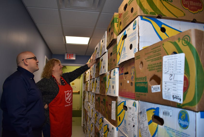 Major Corey Vincent and Nicole MacLean, community ministries co-ordinator for the Salvation Army Sydney Community Church, look over boxes that will hold Christmas hampers during the 2017 holiday season. GREG MCNEIL/CAPE BRETON POST