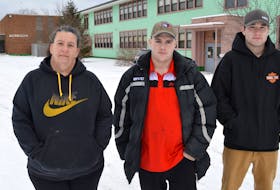 Members of the Glace Bay Y’s Men’s and Women’s Club Jeanette MacDonald, from left, Jeff Knarr and Adam Verge stand in front of the former Morrison Junior High School. The club purchased the school from the International Centre for English Academic Preparation where they plan on creating a community hub.