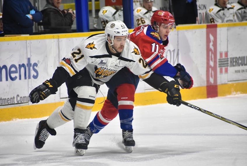 Peyton Hoyt if the Cape Breton Screaming Eagles, left, and Jakob Pelletier of the Moncton Wildcats jostle for position during QMJHL action Wednesday at Centre 200.