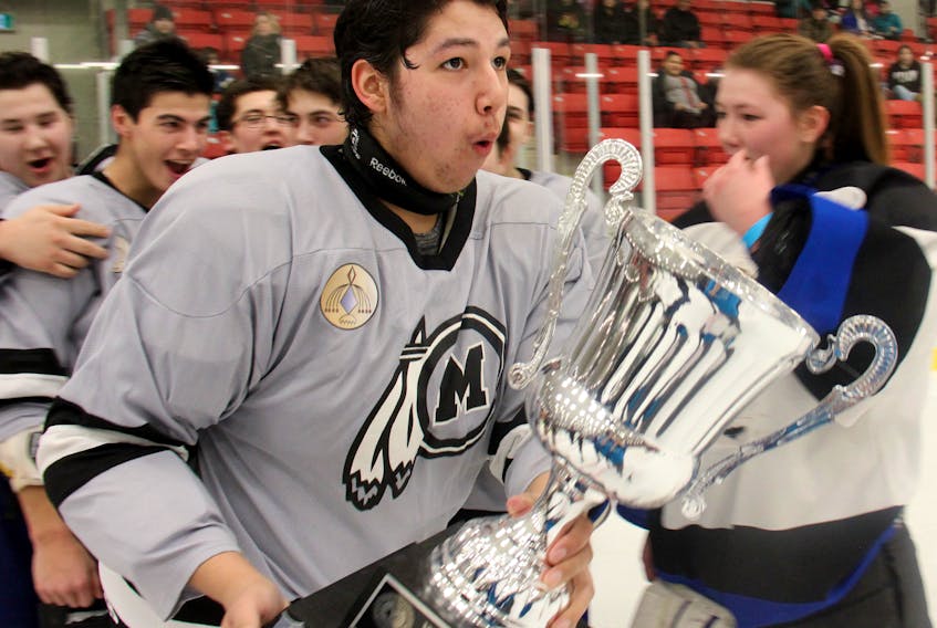 Brody Joe of the Membertou team skates with the trophy awarded to the midget division champions at last year’s Wallace Bernard Memorial Native Youth Hockey Tournament at the Membertou Sport and Wellness Centre. The 45th edition of the tournament opens today.