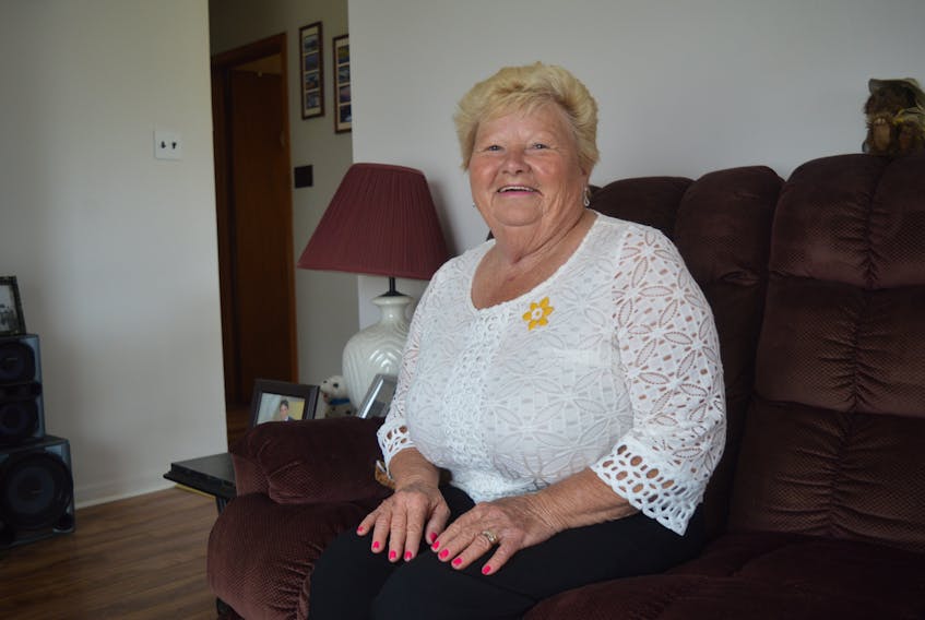 Mary Phillips, 69, sits in the living room of her Sydney home. The cancer survivor is the community champion and a guest speaker at the Relay for Life happening Friday at the Centre 200.