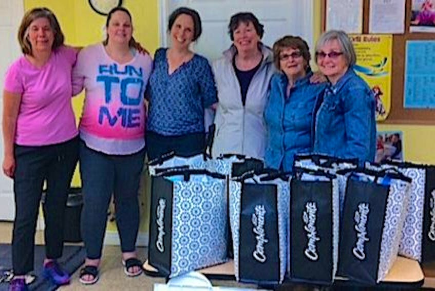 The Spanish Bay branch of the Women's Institute of Nova Scotia made a donation of 20 mom-to-be preparation packs to the Family Resource Centre in Sydney, thanks to a grant they received from the community health board. Included are receiving blankets, sleepers and diapers. From left, Sheila Cassidy, Amy MacNeil, Cathy Milburn, Kay MacDonald, Gerry MacAulay and Brenda Skinner.