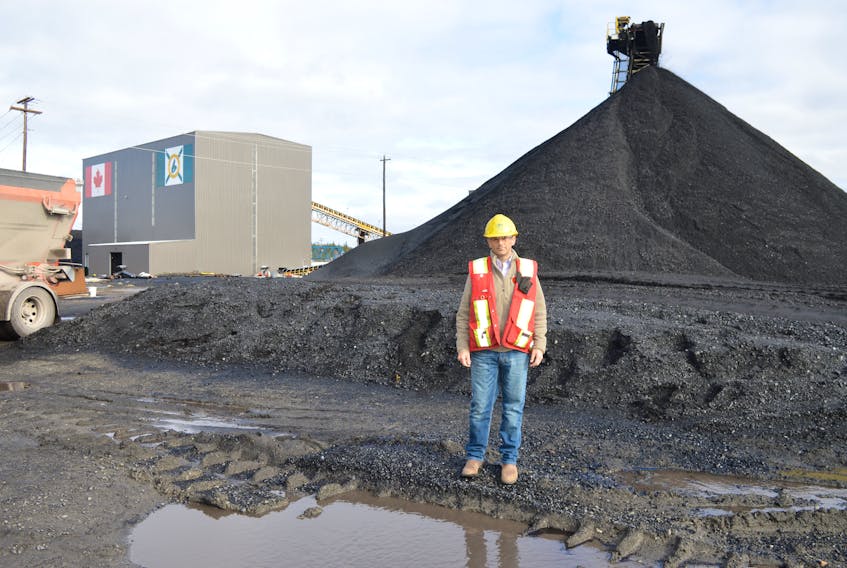 Donkin Mine vice-president Shannon Campbell walks along the grounds while coal comes off a conveyor belt in the background. SHARON MONTGOMERY-DUPE/CAPE BRETON POST
