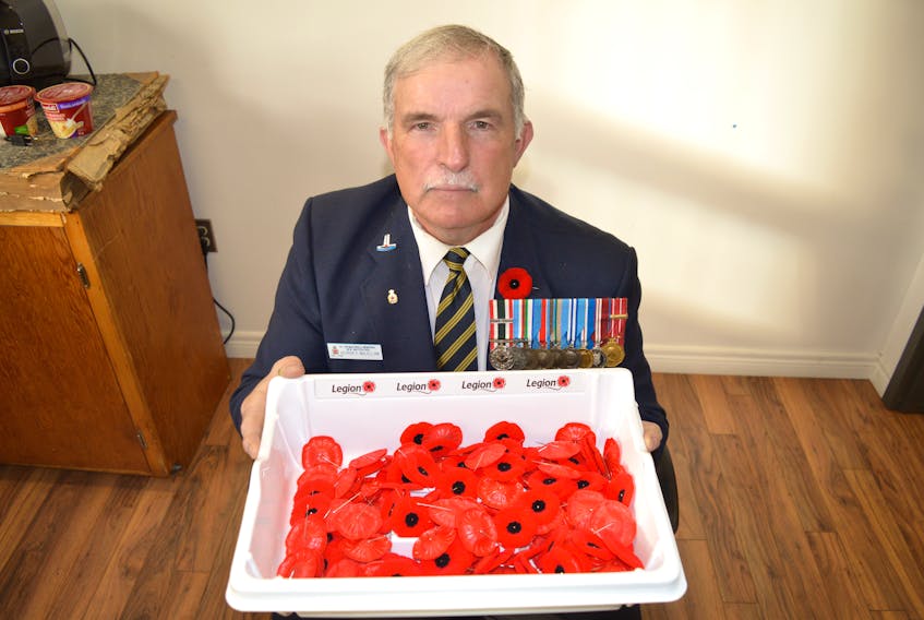 George McLellan, veteran and spokesperson for Royal Canadian Legion branch 15 in New Waterford, holds a tray of poppies.