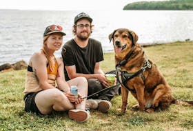 Alysha Jessome, from left, her partner Shane Wilkie and their dog Randy. Jessome has organized a community walk along the Baille Ard Trail on Saturday at noon. The CBRM’s preliminary plans, which have already been approved by council, could see eight large embankments — each eight feet high, 50 feet wide and between 300 and 400 metres long — cutting across large sections of the 70-acre forest and four-kilometre trail system.