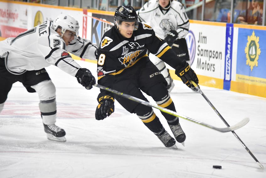 Alexandre Landreville of the Gatineau Olympiques, left, tries to stop Phélix Martineau of the Cape Breton Screaming Eagles during the first period of Quebec Major Junior Hockey League play Thursday at Centre 200. Gatineau won the game, 6-3. T.J. Colello/Cape Breton Post